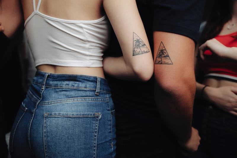 Matching scenes couple tattoos